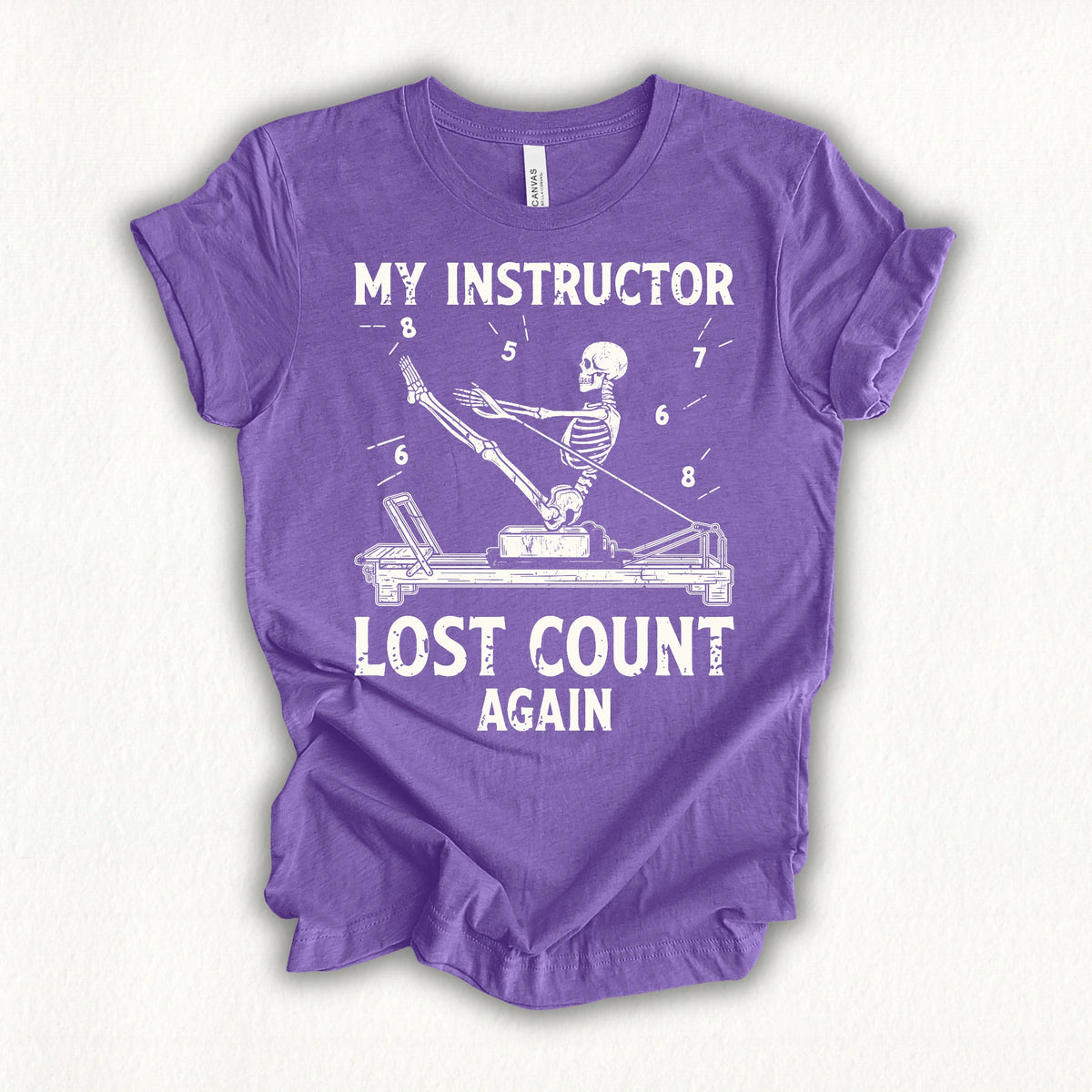 MY INSTRUCTOR LOST COUNT AGAIN heather team purple shirt in MindCloth Pilates Tshirt Collection